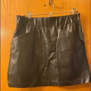 Black skirt size medium never worn tag is still on skirt.